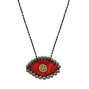 Handmade red velvet evil-eye necklace embroidered with hematite stones and finished with a handcrafted brass sun on an adjustable knotted cord.