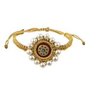 Small round velvet evil eye bracelet with gold-thread folklore embroidery, cultured freshwater pearls and a handmade brass circle on an adjustable macramé cord.