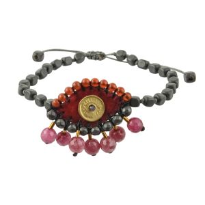 Small velvet evil eye bracelet embroidered with hematite, jade and carnelian, handmade brass eye, hematite rosary base, macramé closure. Burgundy velvet with pink gemstone teardrops.