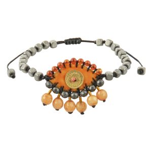 Orange velvet evil-eye bracelet embroidered with hematite, jade and carnelian stones, a handcrafted brass eye, hematite rosary base and a macramé closure.